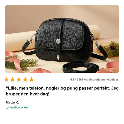 avis — Oval skuldertaske til damer – let og rummelig